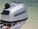 A close up of a Honda outboard unit 